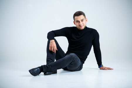 young businessman in black golf and jeans