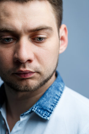 Closeup portrait of a man in a white polo on a white background. Male image for every day. Stylish...