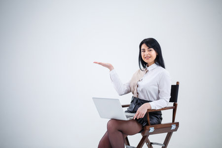 girl teacher, businessman is studying a new project on a laptop. Working day conceptの写真素材