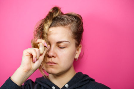 Portrait of a girl. Face without makeup. Violence in family.の写真素材