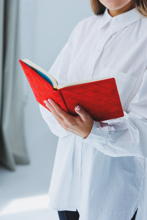 Red notebook for business notes. Women's case notebookの写真素材