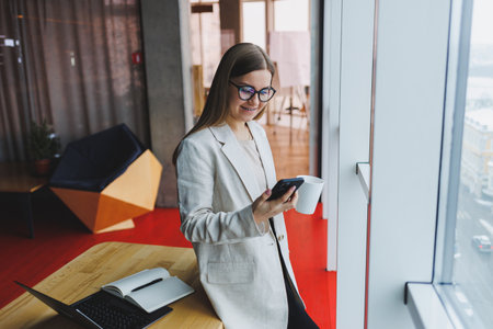 Young beautiful woman businessman uses smartphone for business, online shopping, money transfer,...