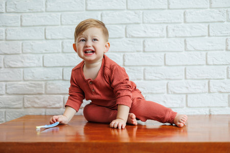A small child learns to brush his teeth with a toothbrush. Dental hygiene in childrenの写真素材
