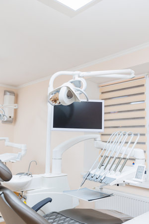 Modern stylish bright dental office with a new chair for receiving patients. selective focusの写真素材