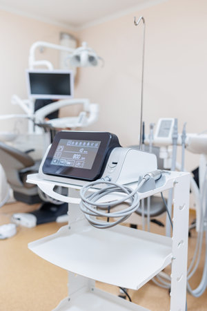Modern dental clinic, dental chair and other accessories used by dentists in medical light.の写真素材