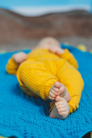 Close-up of the legs of a small baby. Children's feet.