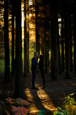 Couple in sweaters in the autumn parkの写真素材