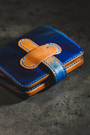 Nice leather wallet. The skin is blue and brown. Handmade expensive products. A gift for men and women.の写真素材