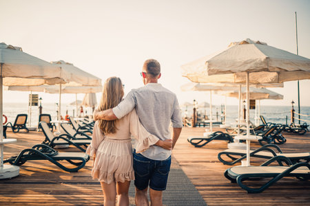 A loving couple is resting at the sea in Turkey. Man and woman on the pier. Sea tour. Honeymoon. Couple on a honeymoon trip. A beautiful couple travels the world. Happy couple on vacation.の写真素材