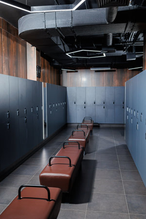 A modern dressing room for people to change before training. Dressing room in the gymの写真素材