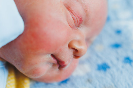 Baby's lips close-up. The face of a newborn child.