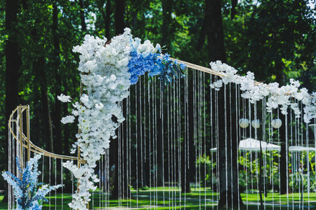 Arch for the wedding of the newlyweds. Arch of flowers on the background of the forest.