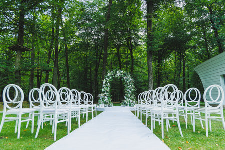 Arch for the wedding of the newlyweds. Arch of flowers on the background of the forest.の写真素材