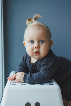 Little 8 month old boy with a smile on his face. Emotions of a small baby.の写真素材