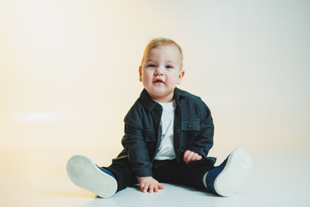 Little stylish boy, 1 year old child in shirt and white t-shirt. Stylish clothes for babies.の写真素材
