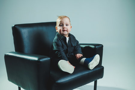 Baby in cool casual clothes. Little stylish boy, 1 year old child in shirt and white t-shirt....