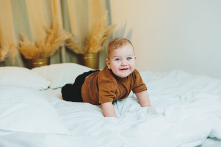 Baby in cool casual clothes. Little stylish boy, child 1 year old in jeans and t-shirt. Stylish clothes for babies.の写真素材