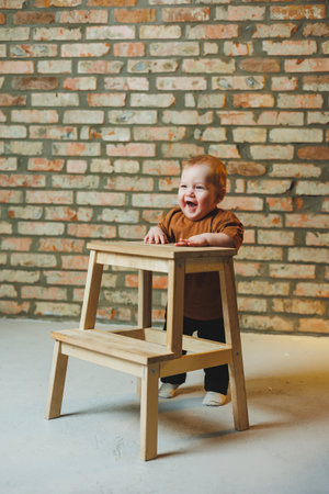 Baby in cool casual clothes. Little stylish boy, child 1 year old in jeans and t-shirt. Stylish clothes for babies.の写真素材