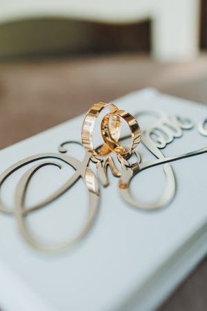 Gold wedding rings for newlyweds. Precious wedding rings for a couple.の写真素材