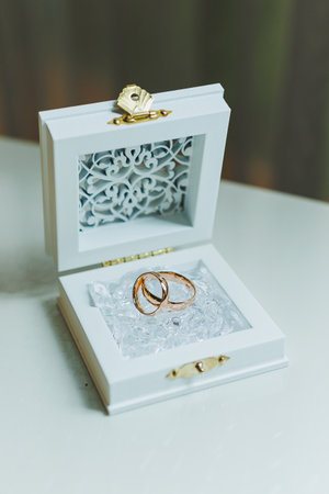 Gold wedding rings for newlyweds. Precious wedding rings for a couple.