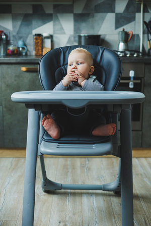 A baby boy eats a delicious avocado. The baby's first meal. The child eats an avocadoの写真素材