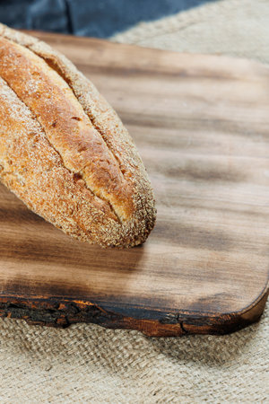 Freshly baked rye bread on a mixture of whole grain, rye and wheat flour. Fresh homemade bread. Craft pastriesの写真素材