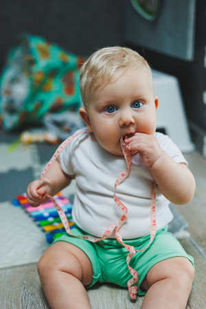 A toy baby at home for development or learning, a child in the bedroom for motor development. A small child of cognitive development.の写真素材