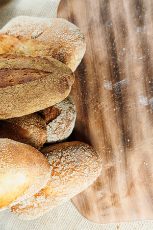 Homemade bread, bread with wheat and spelled flour. Texture of bread sliced and cut in half on a...