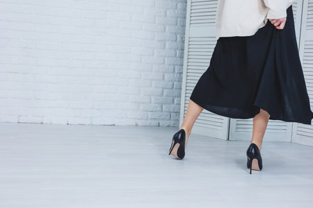 Female legs in high heels. Women's party shoes.の写真素材