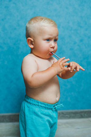 Little boy in shorts running at home and laughing. Happy child playing at home.の写真素材