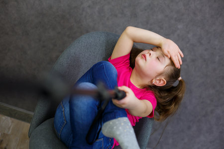 Girl in A T-shirt takes a selfie on her phone and posesの写真素材