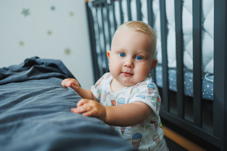 Cute little boy playing at home and laughing. cheerful kid laughs. An emotional childの写真素材