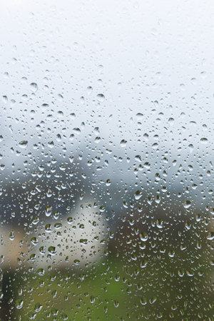 Raindrops on the glass in the window. Wet window after rain. Rain outside the window.