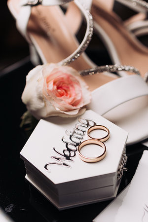 Details for the bride. Wedding rings for the newlyweds with the bride's accessories. Precious...