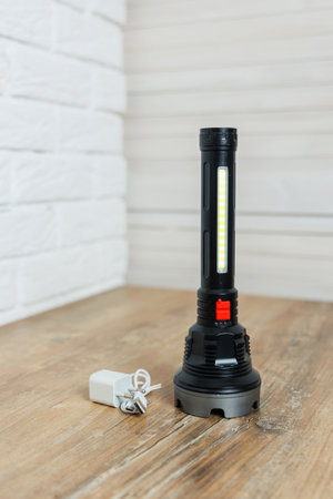 This durable LED flashlight features a powerful rechargeable battery, providing bright illumination...