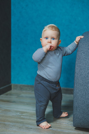 A curious toddler joyfully explores a vibrant indoor space, reflecting themes of curiosity and...