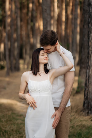 A loving couple in a tranquil forest setting, beautifully showcasing their deep intimacy and connection with natureの写真素材