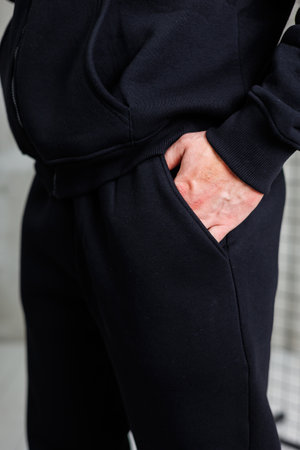 This stylish black tracksuit is expertly designed for optimal comfort and ideal for everyday wear for youの写真素材