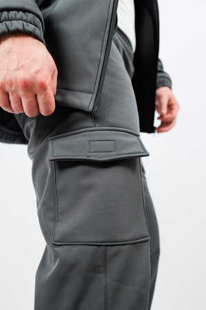 A detailed closeup image showcasing a person who is wearing stylish cargo pants, emphasizing their unique pockets and practical designの写真素材