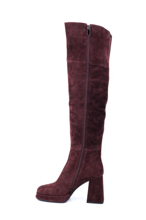 Stylish women's suede ankle boots with red heels with square toes on a white background. Winter leather women's shoes with elegant heels and buckles.の写真素材