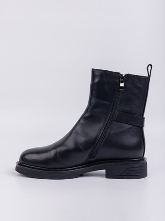 Women's boots on a flat sole made of genuine leather on a white background. Autumn casual women's shoes.の写真素材