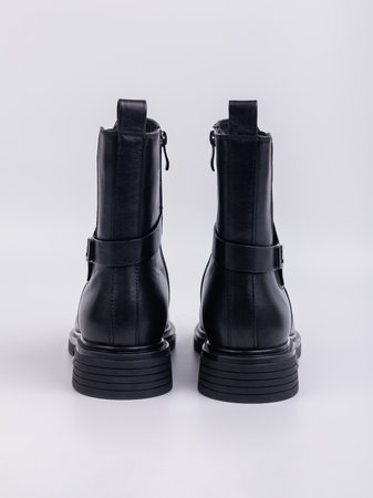 Women's boots on a flat sole made of genuine leather on a white background. Autumn casual women's shoes.の写真素材