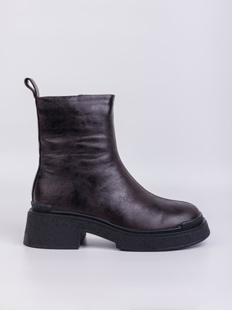 Women's boots on a flat sole made of genuine leather on a white background. Autumn casual women's shoes.の写真素材