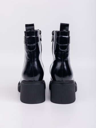 Women's boots with black zippers made of natural leather on a white background. Women's autumn casual shoes. Comfortable boots for women.の写真素材