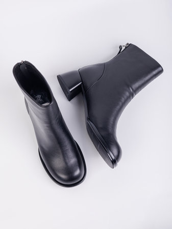Women's boots with black zippers made of natural leather on a white background. Women's autumn casual shoes. Comfortable boots for women.の写真素材