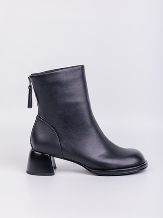 Women's boots with black zippers made of natural leather on a white background. Women's autumn casual shoes. Comfortable boots for women.の写真素材