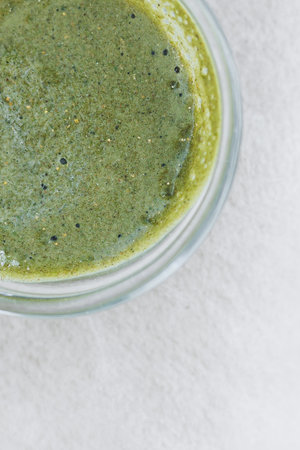 Indulge in a deliciously nutritious green smoothie, which is ideal for health enthusiasts who are looking for a refreshing energy boost with every single sip they takeの写真素材