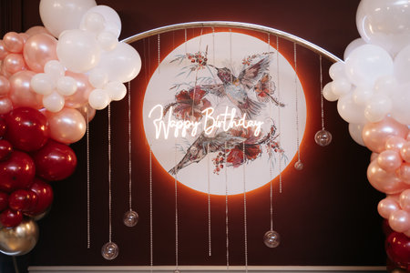 This vibrant birthday backdrop features colorful balloons and a chic neon Happy Birthday sign, perfect for enhancing your celebration and creating fun memoriesの写真素材