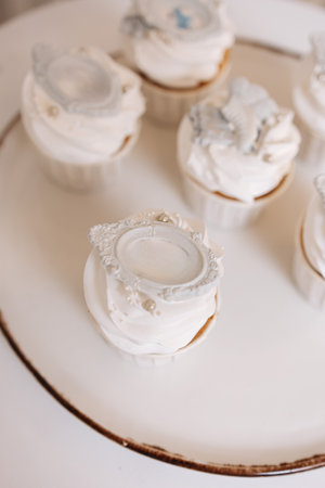 Enjoy luscious cupcakes topped with rich whipped frosting, beautifully decorated for weddings, birthdays, and all special events that deserve a memorable sweet touchの写真素材