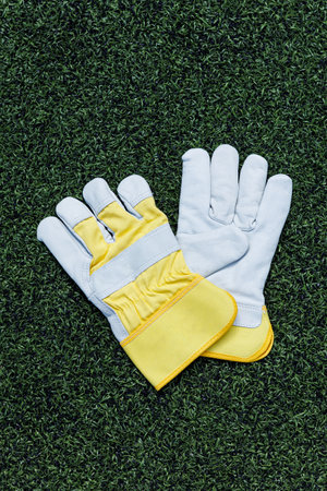 These highly durable work gloves expertly combine premium leather with advanced synthetic materials to provide optimal grip, comfort, and protection in various industrial settingsの写真素材